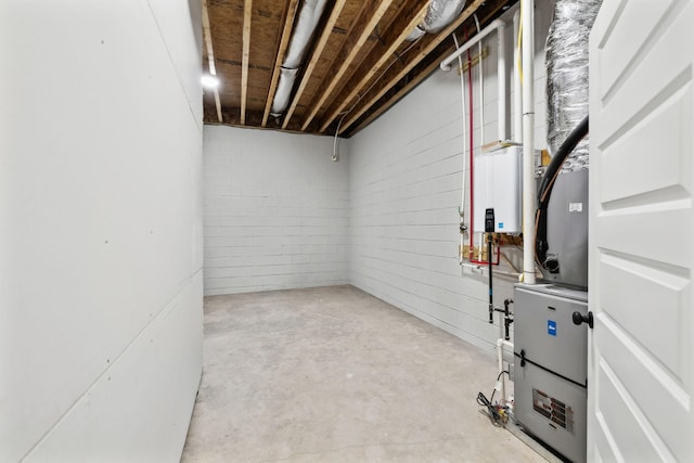 unfinished basement featuring water heater