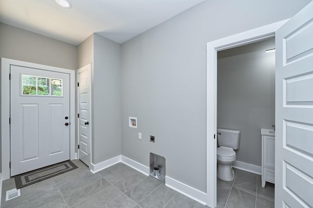 laundry room featuring hookup for a washing machine, tile patterned floors, baseboards, and hookup for an electric dryer