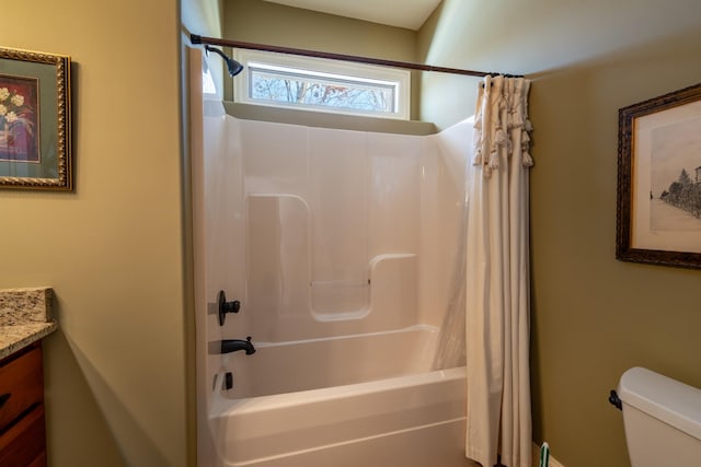 full bathroom featuring shower / bath combination with curtain, vanity, and toilet