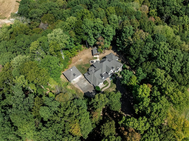 drone / aerial view featuring a forest view