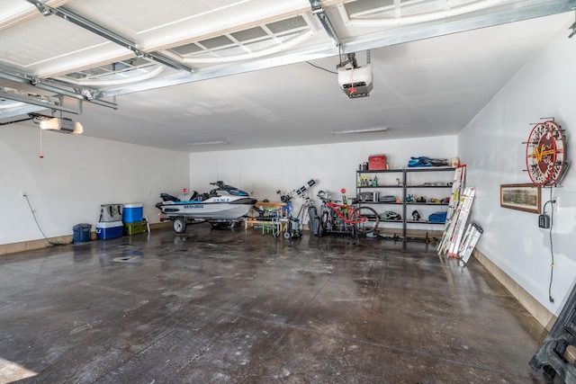 garage with baseboards and a garage door opener