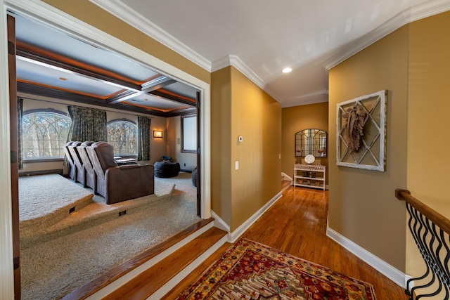 hall featuring wood finished floors, baseboards, coffered ceiling, recessed lighting, and crown molding