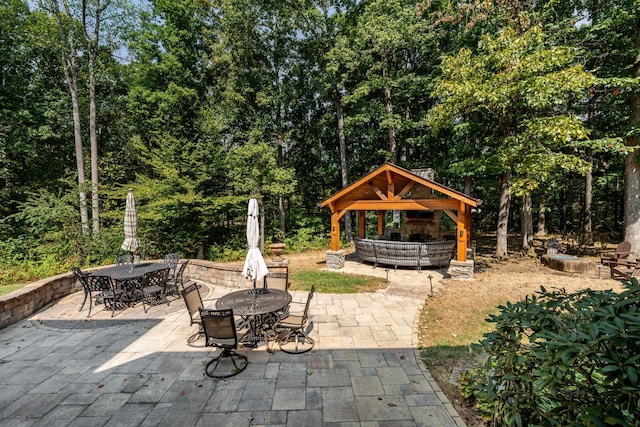 view of patio / terrace featuring a gazebo and outdoor dining area