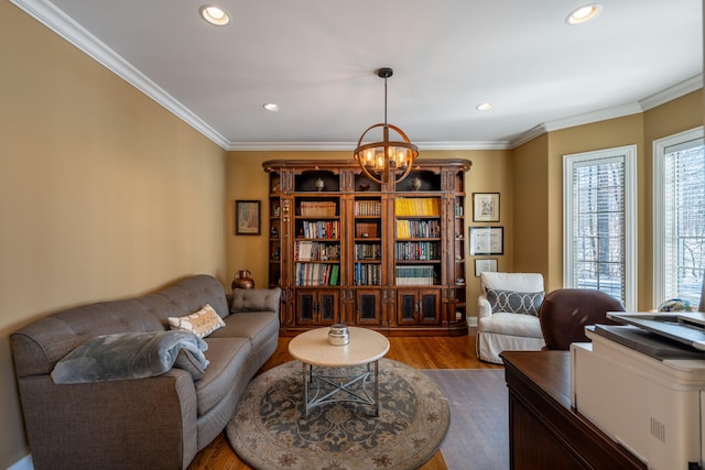 living area featuring crown molding, recessed lighting, wood finished floors, and a chandelier