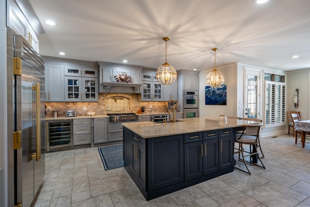 kitchen with beverage cooler, stainless steel appliances, a breakfast bar, and tasteful backsplash