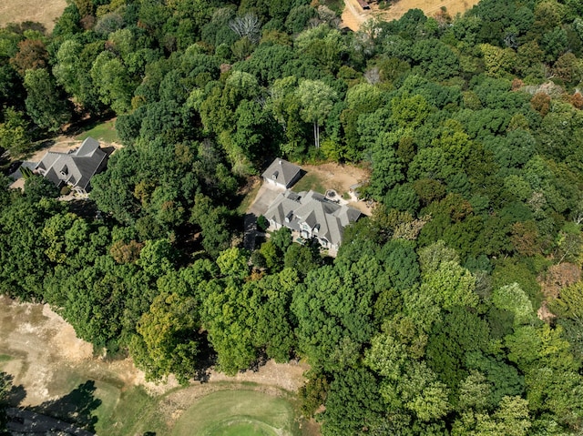 birds eye view of property featuring a view of trees