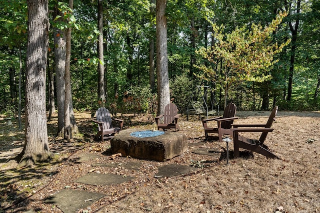 view of yard with a view of trees