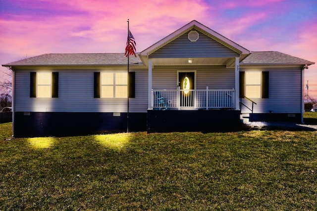 ranch-style house featuring crawl space, a porch, and a yard