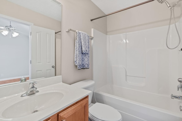 full bath featuring visible vents, toilet, bathtub / shower combination, ceiling fan, and vanity