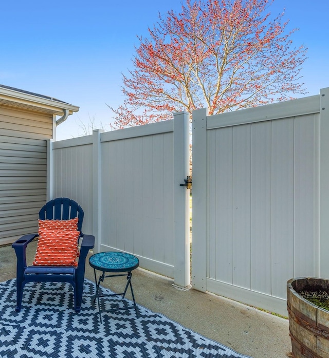 view of patio / terrace featuring fence