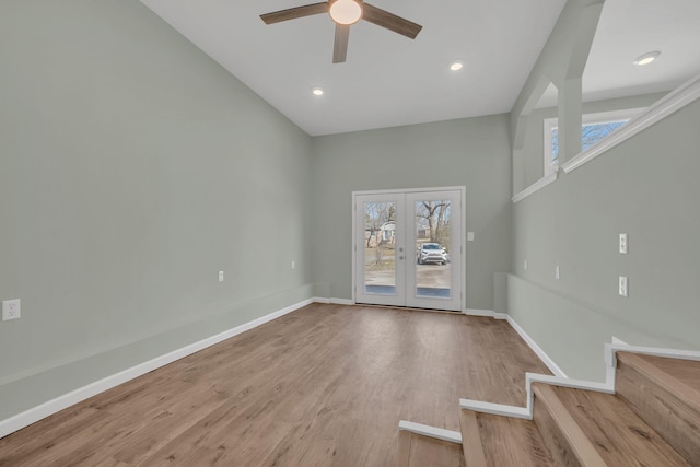 spare room with wood finished floors, baseboards, recessed lighting, ceiling fan, and french doors