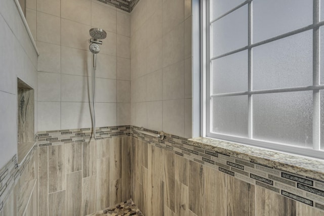 bathroom with tiled shower