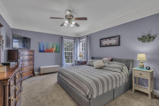 bedroom with ceiling fan, baseboards, carpet, and ornamental molding