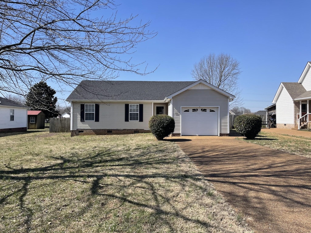 view of front of property featuring a front lawn, fence, aphalt driveway, crawl space, and an attached garage