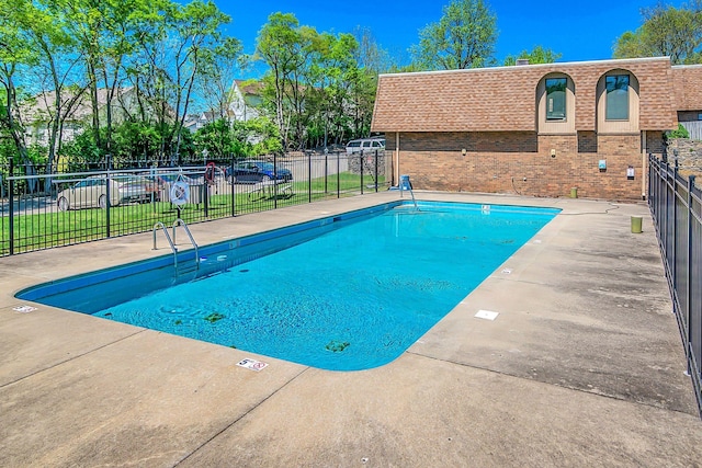 community pool featuring fence