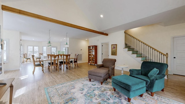 living room featuring stairway, recessed lighting, baseboards, and light wood finished floors