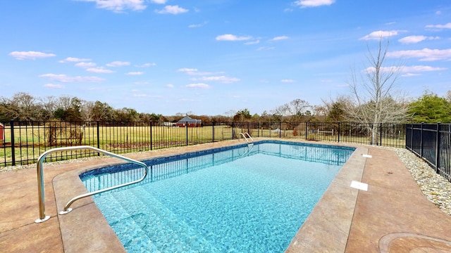 view of swimming pool featuring a fenced in pool and fence