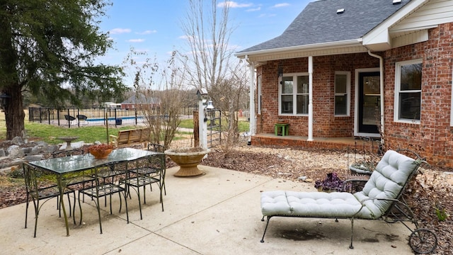 view of patio / terrace featuring fence and a fenced in pool