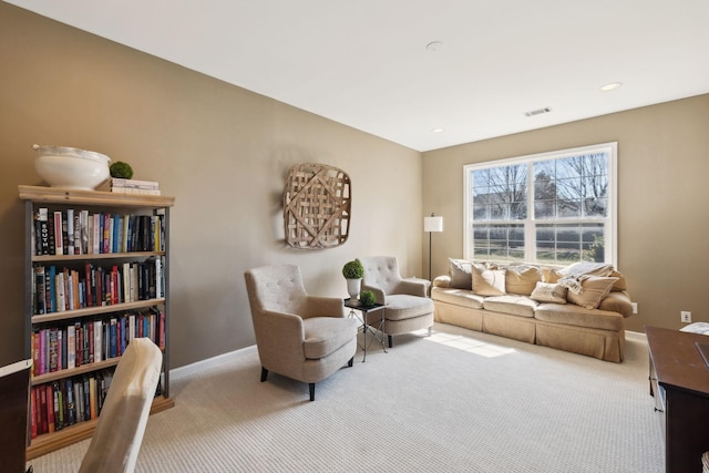 living area with visible vents, recessed lighting, carpet, and baseboards