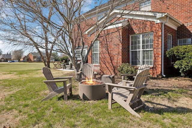 view of yard with an outdoor fire pit