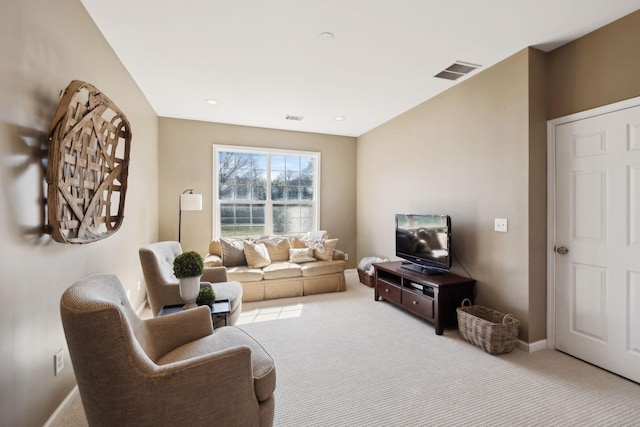 carpeted living area featuring visible vents, recessed lighting, and baseboards