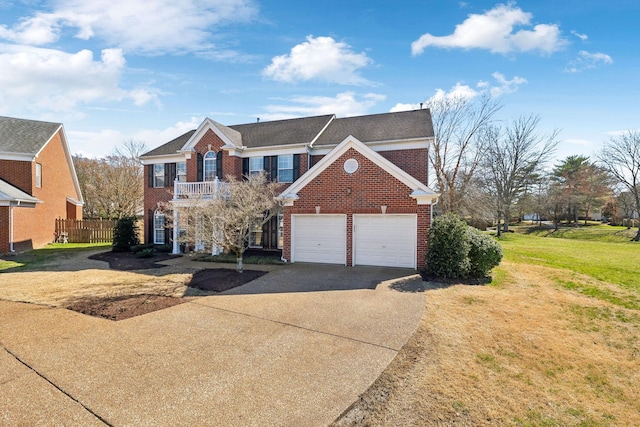 view of front of house featuring brick siding, an attached garage, a front lawn, fence, and driveway