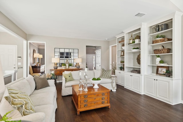 living area featuring dark wood finished floors and visible vents