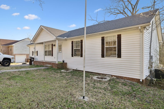 ranch-style house with a garage, a front lawn, and roof with shingles