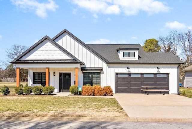 modern farmhouse style home featuring driveway, a standing seam roof, board and batten siding, a front yard, and an attached garage