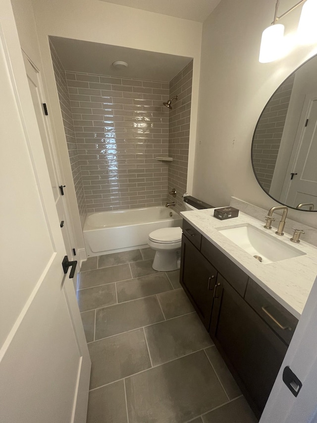 full bath featuring bathtub / shower combination, tile patterned floors, toilet, and vanity