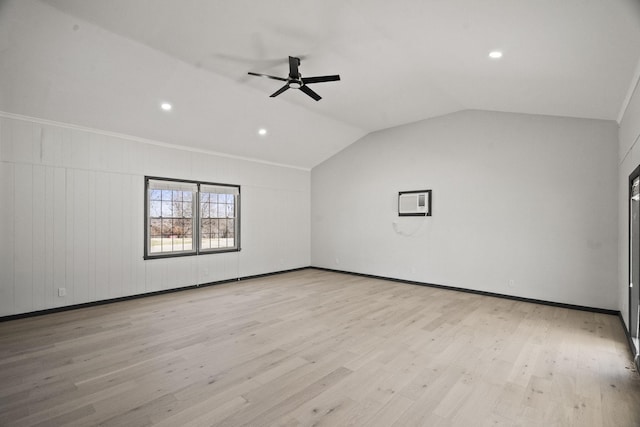 interior space featuring light wood finished floors, baseboards, a ceiling fan, and lofted ceiling