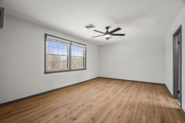 unfurnished bedroom with visible vents, a ceiling fan, baseboards, and wood finished floors