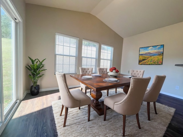 dining area featuring vaulted ceiling, baseboards, and dark wood-style flooring