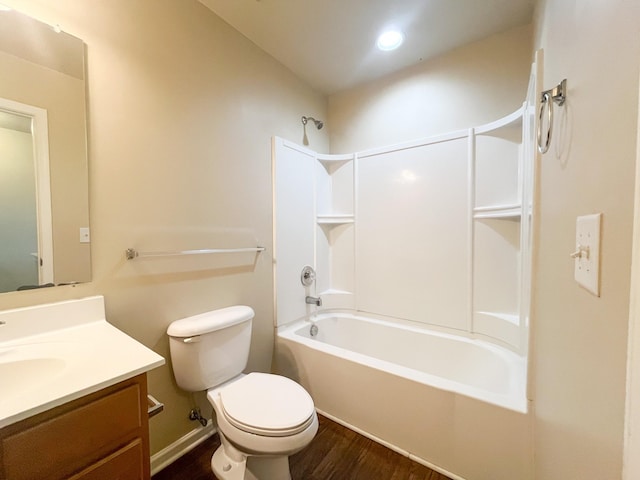 bathroom with shower / washtub combination, toilet, vanity, and wood finished floors