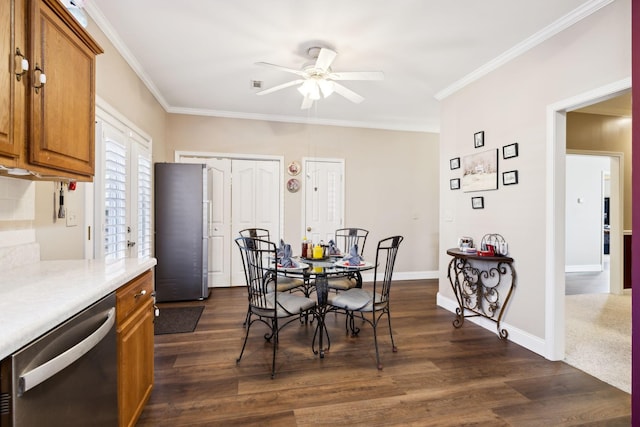 dining area featuring ceiling fan, dark wood-style floors, baseboards, and ornamental molding