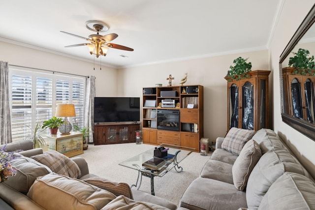 living area featuring light carpet, ceiling fan, and ornamental molding