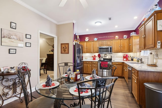 kitchen with light countertops, brown cabinetry, visible vents, and stainless steel appliances