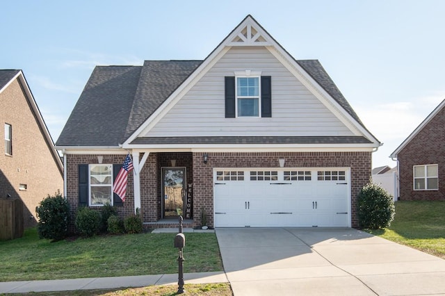 view of front of property with a front lawn, driveway, a shingled roof, a garage, and brick siding