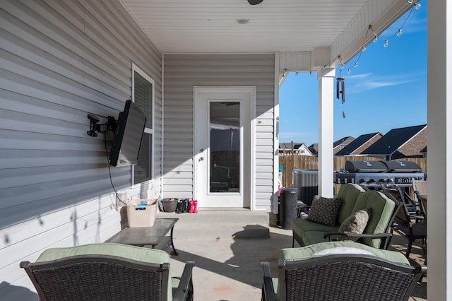 view of patio / terrace featuring an outdoor living space and fence