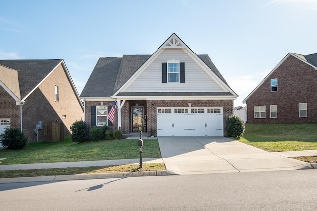 view of front of home featuring a front yard, brick siding, and driveway