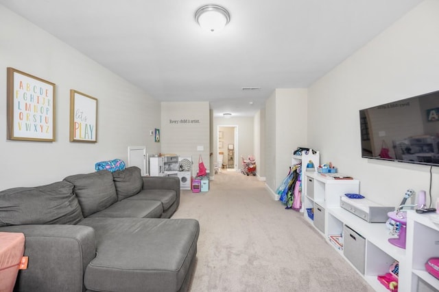 living area with carpet flooring and visible vents