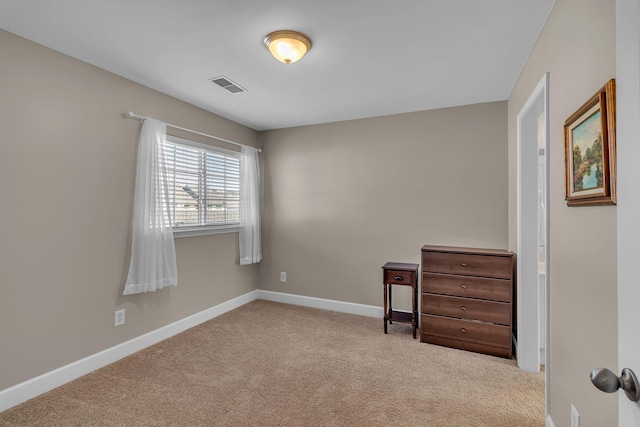 bedroom with carpet, visible vents, and baseboards