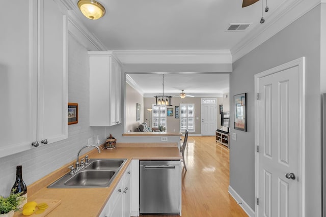 kitchen featuring visible vents, crown molding, dishwasher, a ceiling fan, and a sink