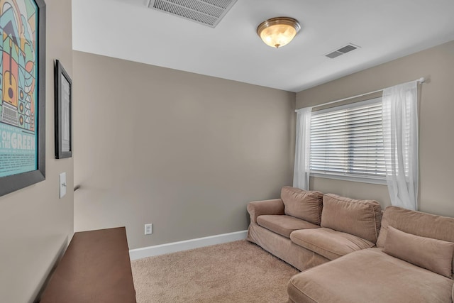 living area with visible vents, carpet flooring, and baseboards