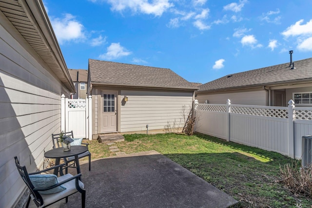 view of yard with a patio area and a fenced backyard