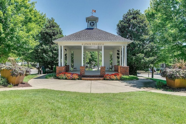 view of home's community with a lawn