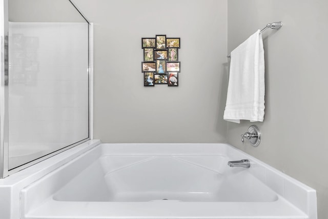 bathroom with a garden tub