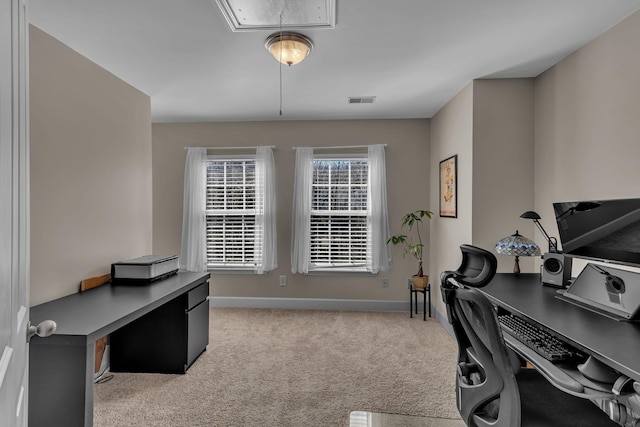 carpeted home office featuring visible vents, attic access, and baseboards