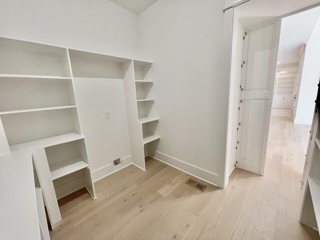 walk in closet with visible vents and light wood-style floors