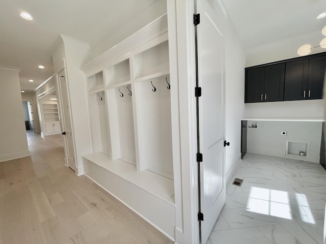 mudroom featuring recessed lighting, marble finish floor, baseboards, and visible vents